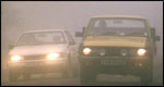 Cars in thick fog