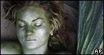 A woman with a green face