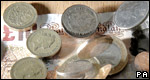 Coins and a £10 note