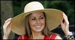 A woman wearing a huge hat