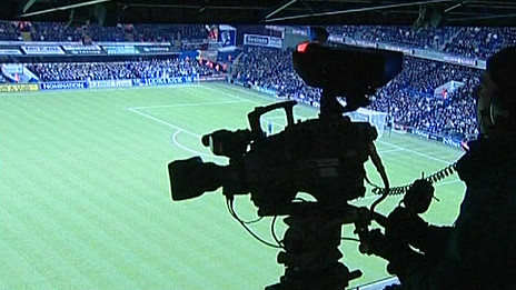 Camera on location at a football match